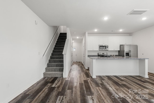 1112 Angle St, Cherryville, NC 28021 - kitchen featuring stainless steel appliances, dark wood-style flooring, white cabinetry, recessed lighting, and baseboards