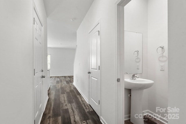 1112 Angle St, Cherryville, NC 28021 - bathroom featuring a sink, wood finished floors, and baseboards