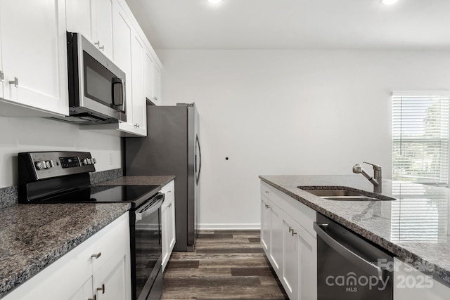 1112 Angle St, Cherryville, NC 28021 - kitchen with stainless steel appliances, a sink, dark wood finished floors, white cabinetry, and dark stone counters