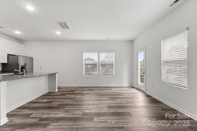 1112 Angle St, Cherryville, NC 28021 - unfurnished living room featuring recessed lighting, dark wood-style flooring, baseboards, and a sink