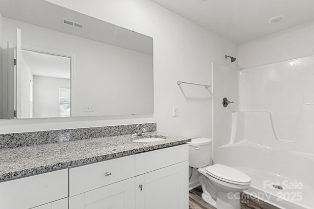 1112 Angle St, Cherryville, NC 28021 - full bathroom featuring toilet, vanity, wood finished floors, and a shower