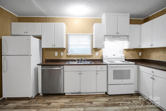 203 Bethlehem Church Rd, Grover, NC 28073 - kitchen featuring white appliances, a sink, under cabinet range hood, dark countertops, and wood finished floors