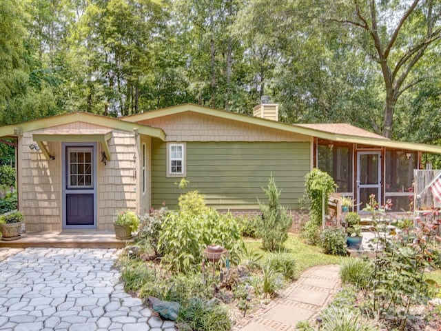 157 Old Hearth Rd, Clover, SC 29710 - view of front of home with a chimney, a sunroom, and view of scattered trees
