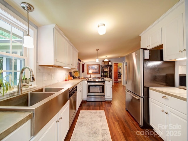 157 Old Hearth Rd, Clover, SC 29710 - kitchen with stainless steel appliances, dark wood finished floors, white cabinets, and a peninsula