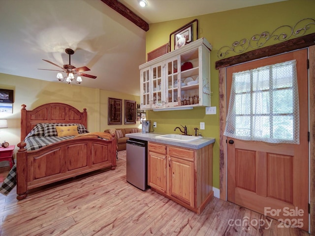 157 Old Hearth Rd, Clover, SC 29710 - kitchen featuring a sink, dishwashing machine, light wood-type flooring, light countertops, and open shelves