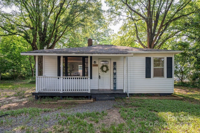 143 Hallman St, Cherryville, NC 28021 - view of front of property with covered porch and a chimney
