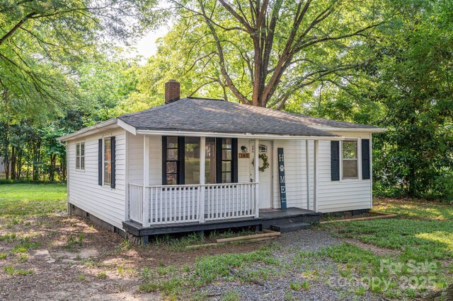 143 Hallman St, Cherryville, NC 28021 - single story home featuring a chimney and covered porch