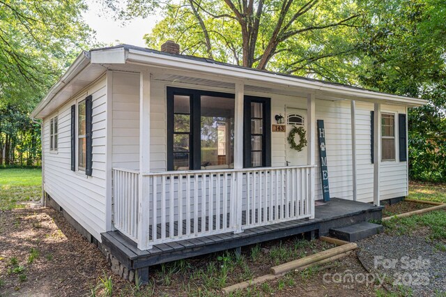 143 Hallman St, Cherryville, NC 28021 - view of front of property featuring a chimney and a porch