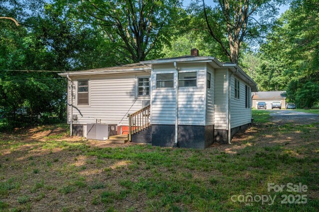 143 Hallman St, Cherryville, NC 28021 - back of property with a chimney