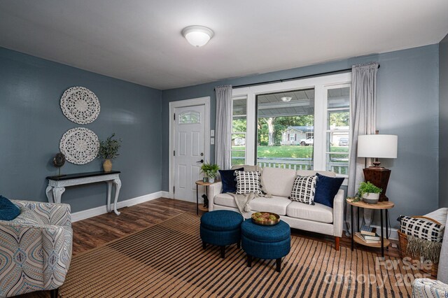 143 Hallman St, Cherryville, NC 28021 - living area with baseboards, wood finished floors, and a baseboard heating unit