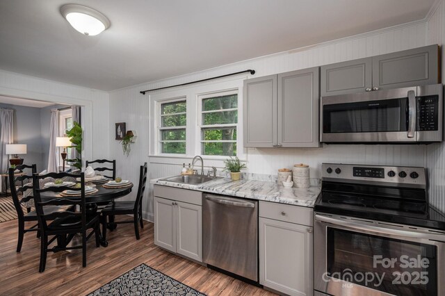 143 Hallman St, Cherryville, NC 28021 - kitchen featuring stainless steel appliances, a sink, gray cabinets, dark wood-type flooring, and light stone countertops