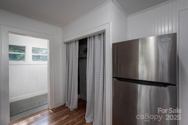 143 Hallman St, Cherryville, NC 28021 - kitchen view of freestanding refrigerator, crown molding, wood finished floors, and baseboards
