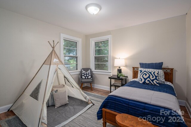 143 Hallman St, Cherryville, NC 28021 - bedroom with wood finished floors and baseboards