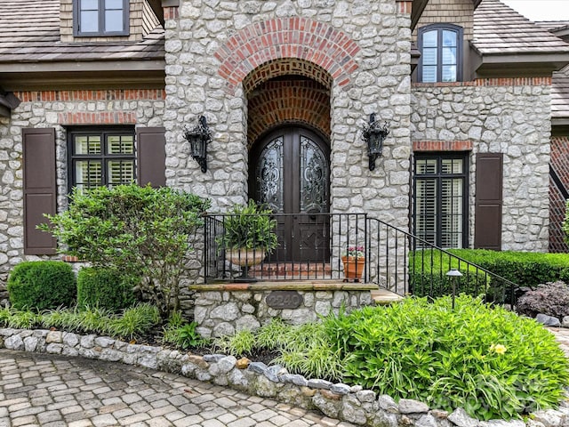 2240 La Maison Dr, Charlotte, NC 28226 - doorway to property featuring stone siding and french doors