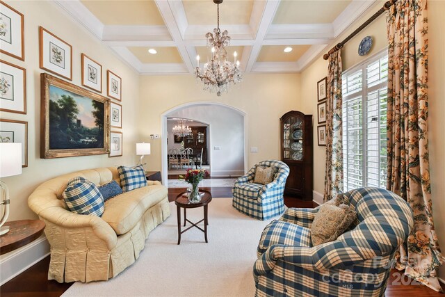 2240 La Maison Dr, Charlotte, NC 28226 - living room with a chandelier, coffered ceiling, beam ceiling, baseboards, and crown molding