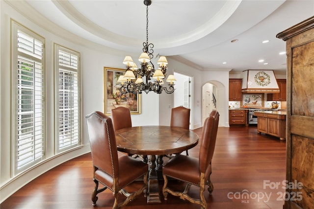 2240 La Maison Dr, Charlotte, NC 28226 - dining area featuring crown molding, dark wood-style flooring, arched walkways, recessed lighting, and a chandelier