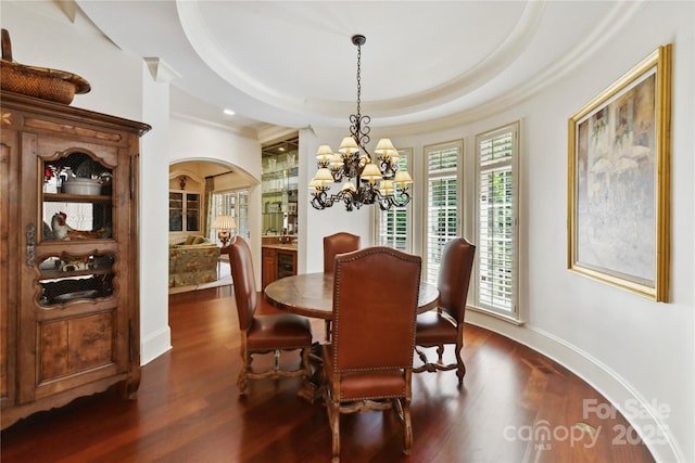 2240 La Maison Dr, Charlotte, NC 28226 - dining area with a chandelier, dark wood-style flooring, crown molding, baseboards, and arched walkways