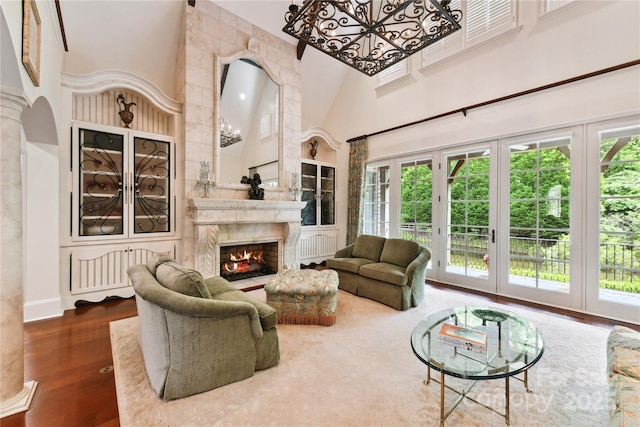 2240 La Maison Dr, Charlotte, NC 28226 - living area with a towering ceiling, a premium fireplace, and wood finished floors