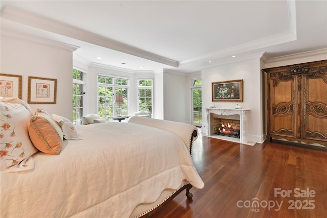 2240 La Maison Dr, Charlotte, NC 28226 - bedroom featuring wood finished floors, crown molding, a fireplace, recessed lighting, and a raised ceiling