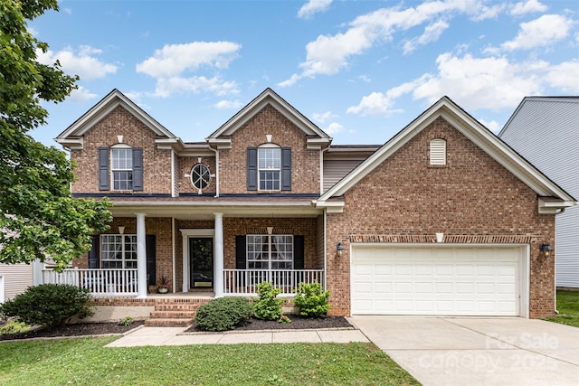 10198 Tintinhull Dr, Fort Mill, SC 29707 - traditional-style house with brick siding, concrete driveway, a porch, an attached garage, and a front yard