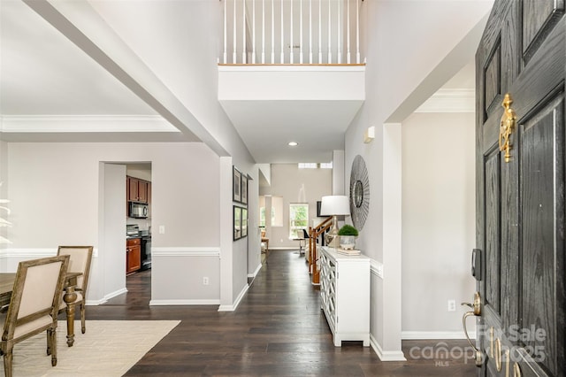10198 Tintinhull Dr, Fort Mill, SC 29707 - entryway with dark wood-type flooring, baseboards, recessed lighting, and ornamental molding