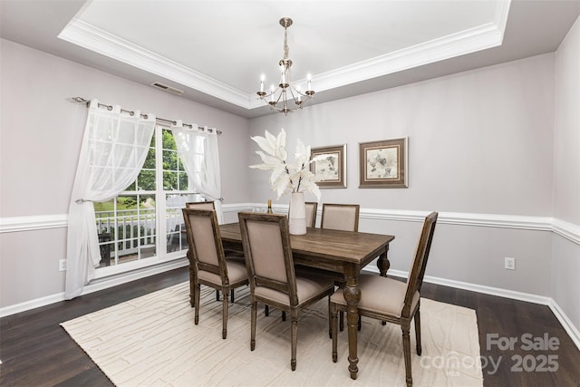 10198 Tintinhull Dr, Fort Mill, SC 29707 - dining room featuring a tray ceiling, a chandelier, crown molding, wood finished floors, and baseboards