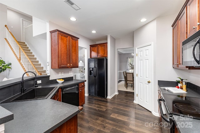 10198 Tintinhull Dr, Fort Mill, SC 29707 - kitchen with black appliances, a sink, dark countertops, dark wood-style flooring, and recessed lighting