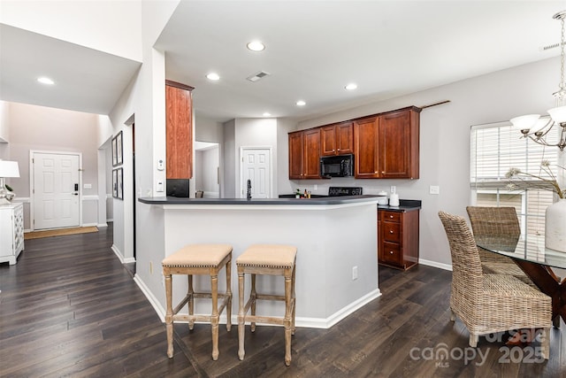 10198 Tintinhull Dr, Fort Mill, SC 29707 - kitchen featuring black microwave, dark countertops, dark wood-style flooring, baseboards, and recessed lighting