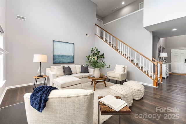 10198 Tintinhull Dr, Fort Mill, SC 29707 - living room featuring stairway, wood finished floors, recessed lighting, baseboards, and a high ceiling