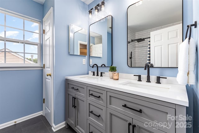10198 Tintinhull Dr, Fort Mill, SC 29707 - full bath with double vanity, tile patterned flooring, baseboards, and a shower
