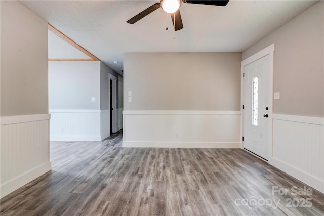 1010 Fallston Rd, Shelby, NC 28150 - spare room featuring wainscoting, a ceiling fan, and wood finished floors