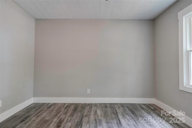 1010 Fallston Rd, Shelby, NC 28150 - unfurnished room with wood finished floors, baseboards, and a textured ceiling
