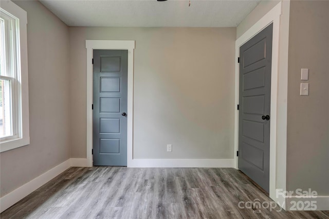 1010 Fallston Rd, Shelby, NC 28150 - unfurnished room with wood finished floors, baseboards, and ceiling fan
