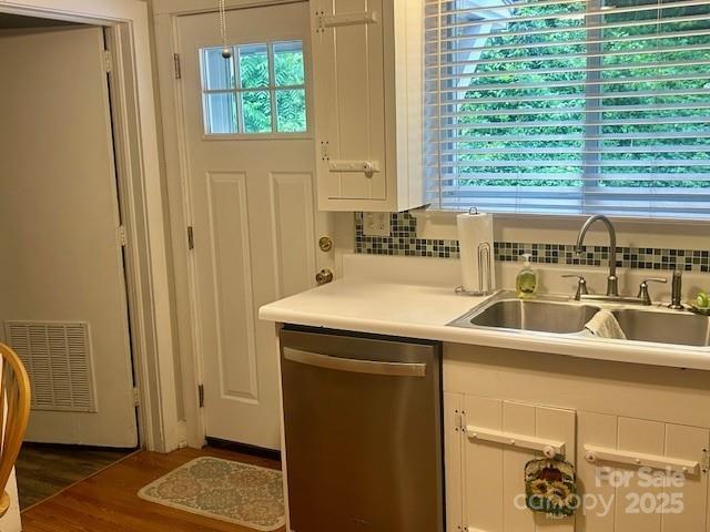 1014 Wright St SW Unit # 4, Lenoir, NC 28645 - kitchen with dishwasher, tasteful backsplash, white cabinetry, and light countertops