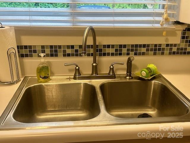 1014 Wright St SW Unit # 4, Lenoir, NC 28645 - kitchen view of a sink and tasteful backsplash