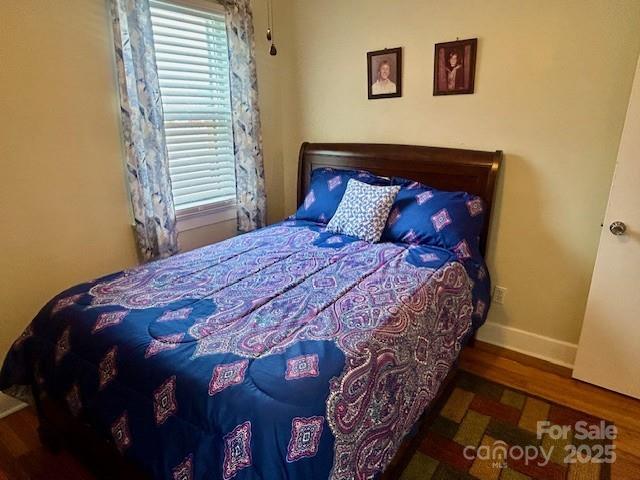 1014 Wright St SW Unit # 4, Lenoir, NC 28645 - bedroom featuring multiple windows and wood finished floors