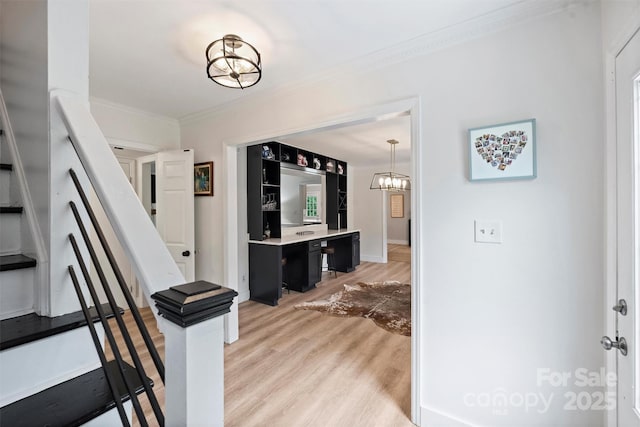 1119 Thornsby Ln, Matthews, NC 28105 - corridor featuring crown molding, light wood-style floors, a chandelier, and baseboards