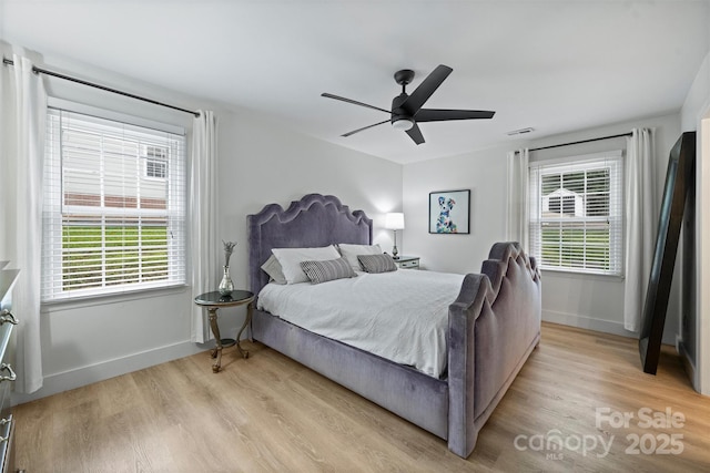 1119 Thornsby Ln, Matthews, NC 28105 - bedroom featuring light wood-style floors, baseboards, and ceiling fan