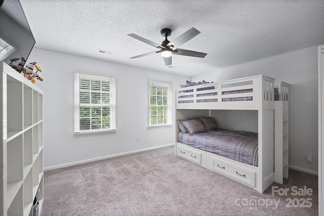 1119 Thornsby Ln, Matthews, NC 28105 - bedroom with a textured ceiling, carpet floors, ceiling fan, and baseboards