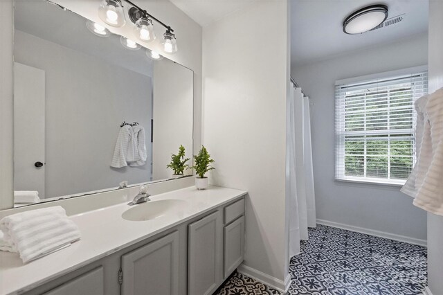 1119 Thornsby Ln, Matthews, NC 28105 - bathroom featuring vanity, baseboards, and a shower with curtain