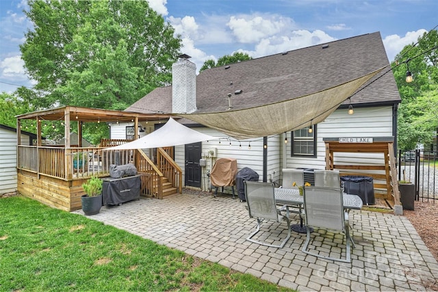 1119 Thornsby Ln, Matthews, NC 28105 - back of house with a patio area, a shingled roof, a deck, and a chimney