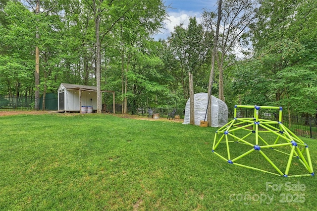 1119 Thornsby Ln, Matthews, NC 28105 - view of yard with a playground and an exterior structure