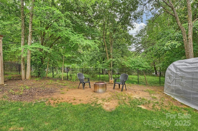 1119 Thornsby Ln, Matthews, NC 28105 - fenced backyard featuring an outdoor fire pit
