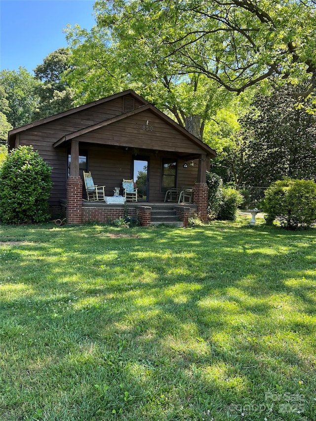 850AND830 E NC-152 Hwy E, China Grove, NC 28023 - rear view of house with a lawn and covered porch