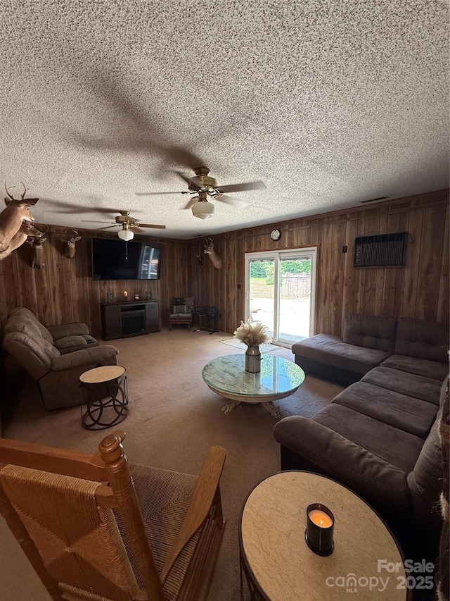 850AND830 E NC-152 Hwy E, China Grove, NC 28023 - carpeted living area with wooden walls, a textured ceiling, and a ceiling fan