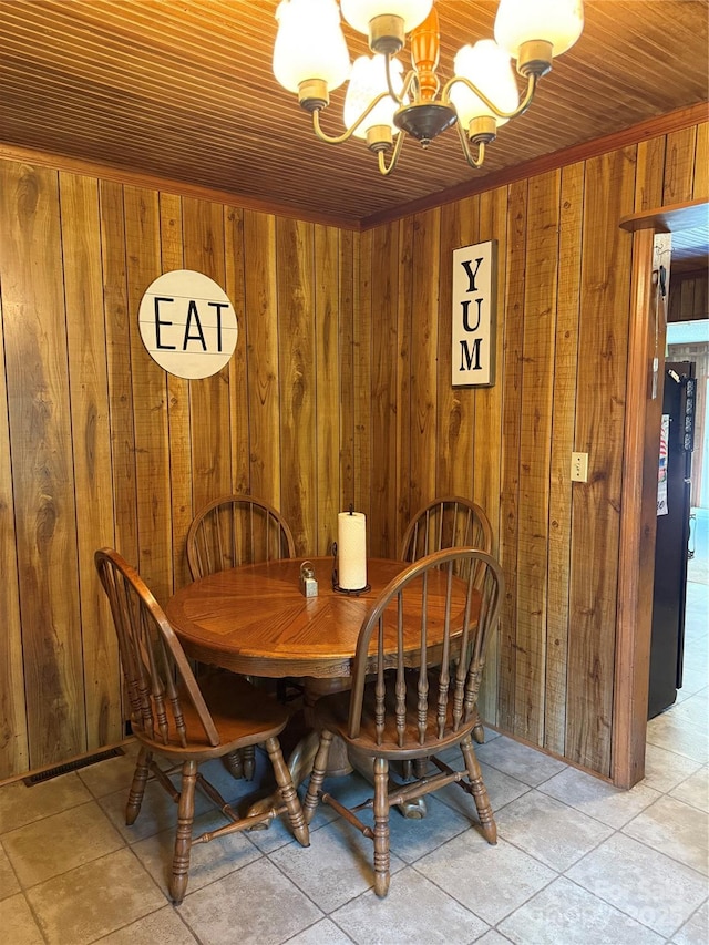 850AND830 E NC-152 Hwy E, China Grove, NC 28023 - dining room with a chandelier, wooden walls, and light tile patterned floors