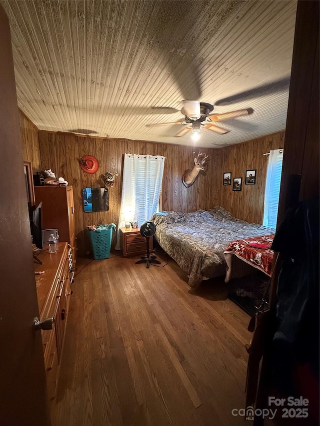 850AND830 E NC-152 Hwy E, China Grove, NC 28023 - bedroom with wooden walls, wood finished floors, a ceiling fan, and wood ceiling