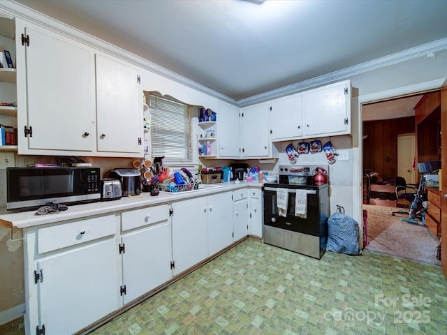 121 Patrick St, Gastonia, NC 28054 - kitchen with appliances with stainless steel finishes, open shelves, white cabinetry, light countertops, and wooden walls