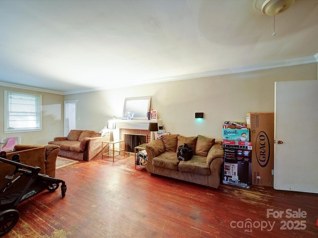 121 Patrick St, Gastonia, NC 28054 - living area with ornamental molding, wood finished floors, and a fireplace