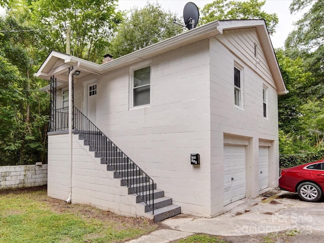 121 Patrick St, Gastonia, NC 28054 - view of side of property with an attached garage and driveway